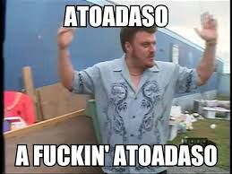 Ricky, from the Canadian mockuseries Trailer Park Boys, wearing a blue bowling button up top with a deep v and a darker blue print of a dragon. He is mid throwing his arms up in the air. The top line reads ATOADASO and the bottom reads A FUCKIN’ ATOADASO
