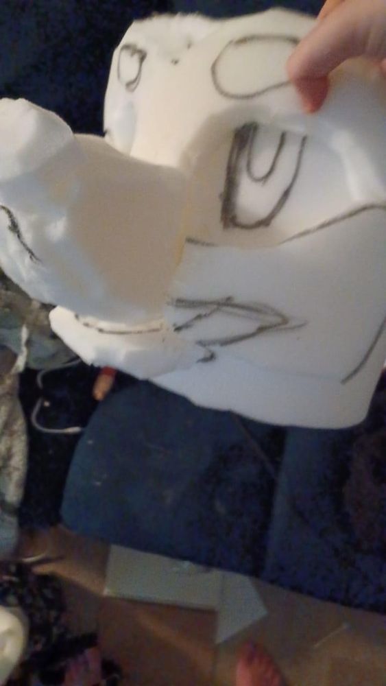 A foam-cut Fursuit head base in the shape of a canine/dog head