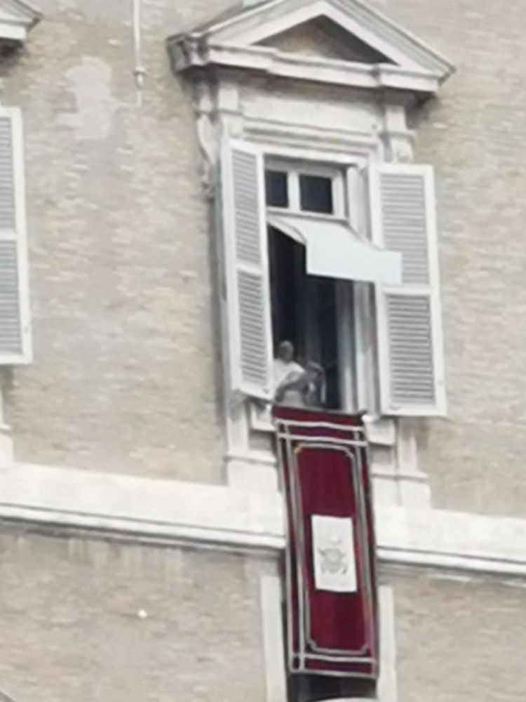 Very blurry photo of Pope Francis giving address from window of apartment in Vatican City 