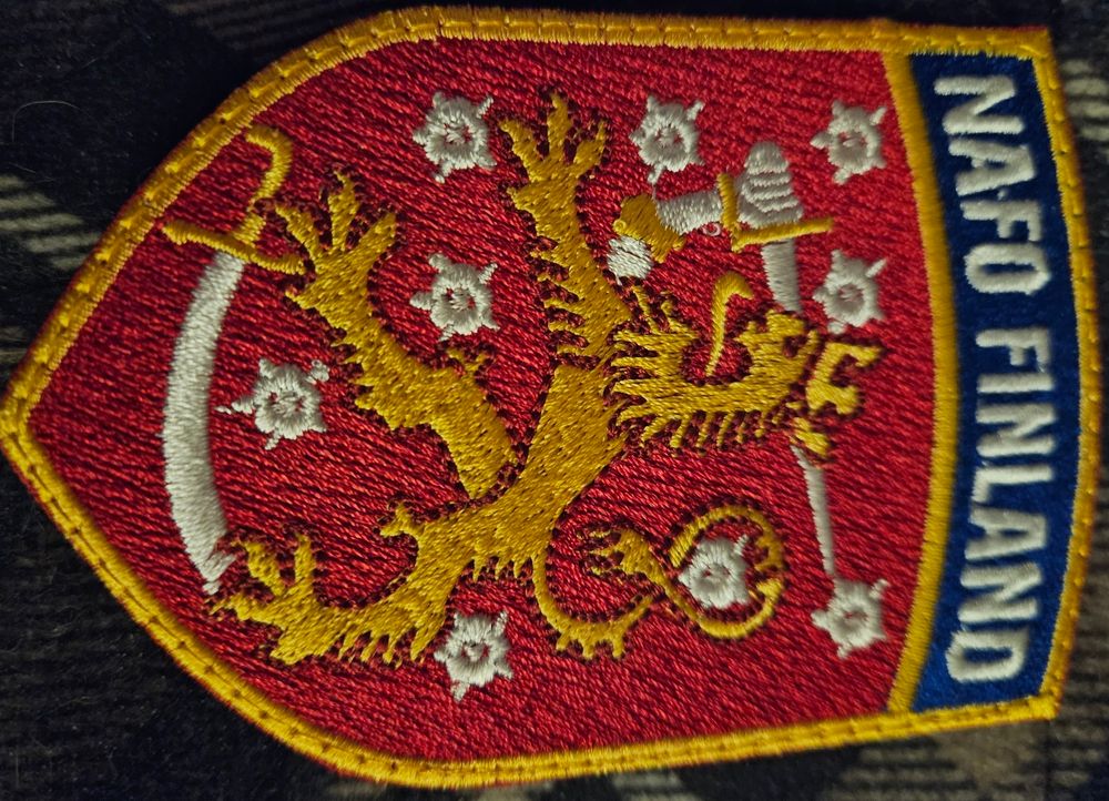 NAFO Finland patch with Finland coat of arms (crowned lion with sword)