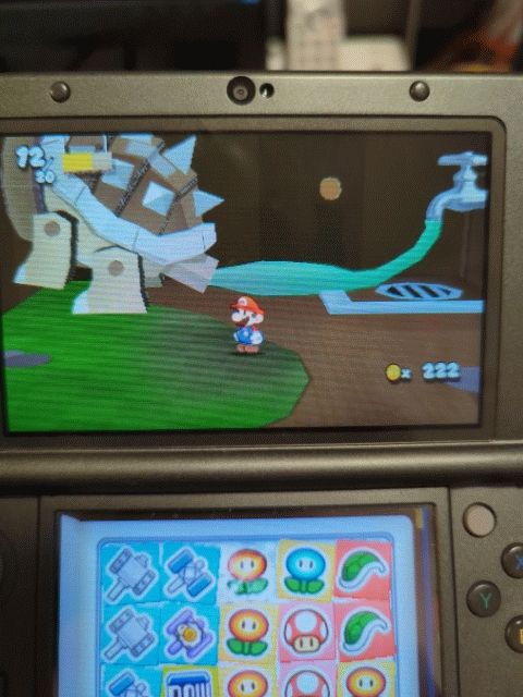 Bowser getting pumped with water from a hose to his ass
