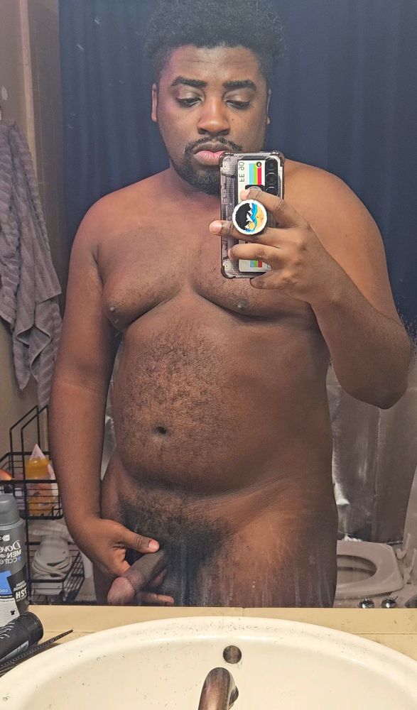 Naked in the bathroom mirror holding my dick
