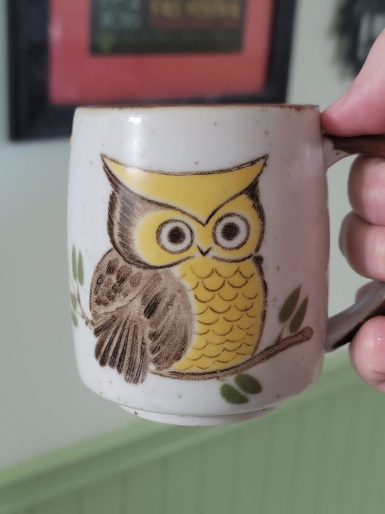 A vintage Otagiri coffee mug featuring a brown and yellow owl sitting on a very thin branch
