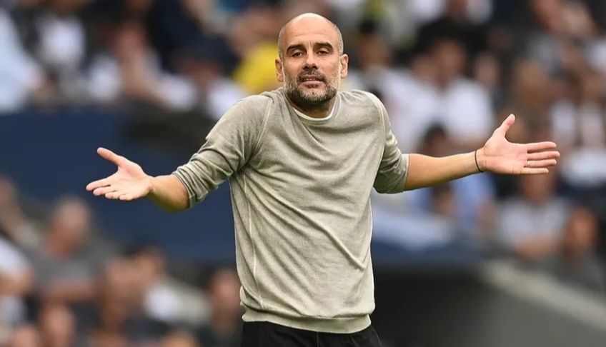 Manchester Citg Pep Guardiola expressing incomprehension.