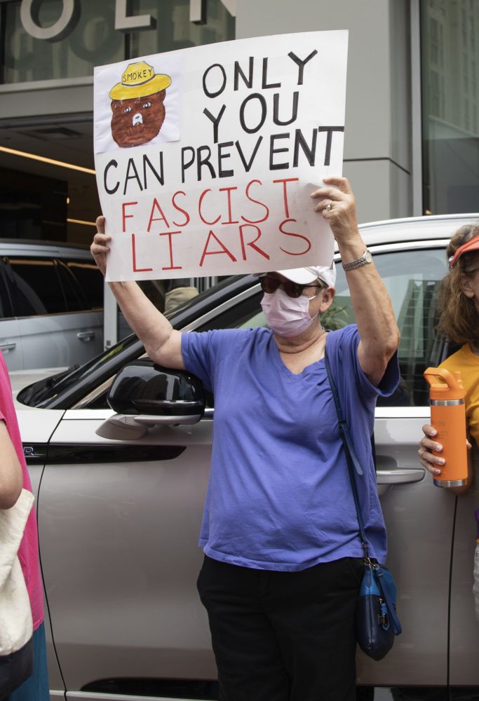 Woman holding sign 