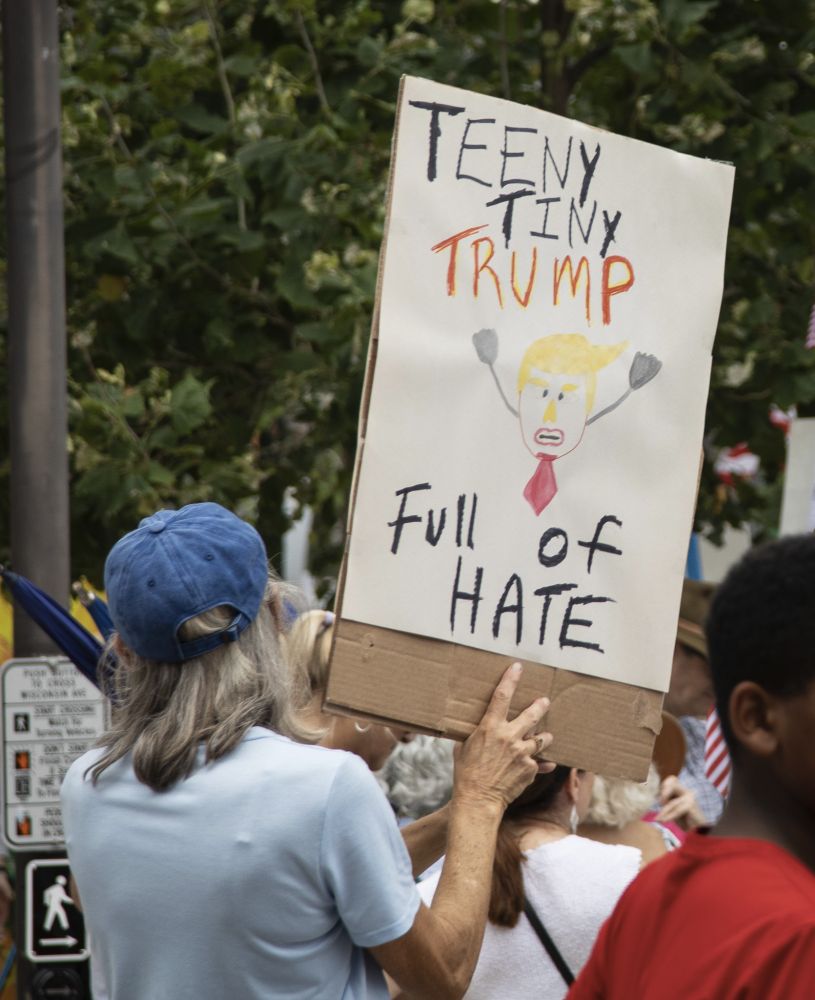 Person holding sign 