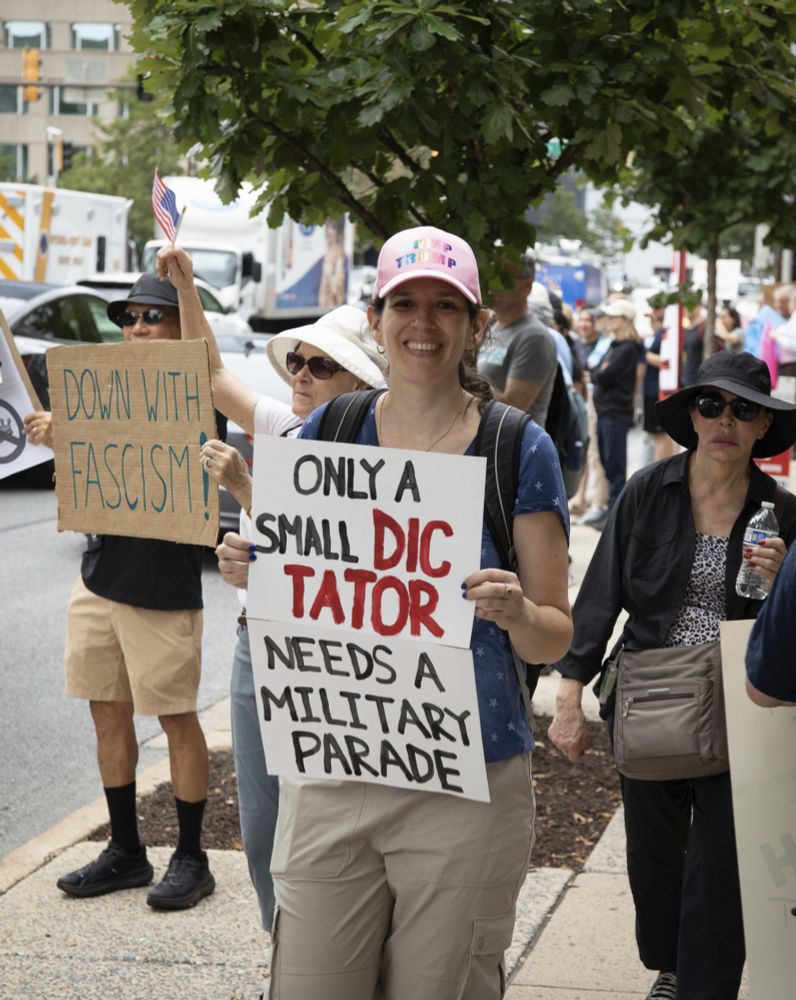 Woman holding sign saying 