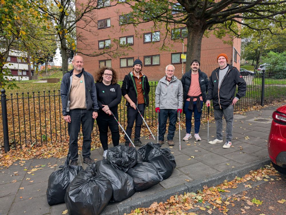 Six people with litter picks standing around a number of black bags that are full of litter. Two of those are Melissa and Mark who are campaigners for the Bridges ward of Gateshead.