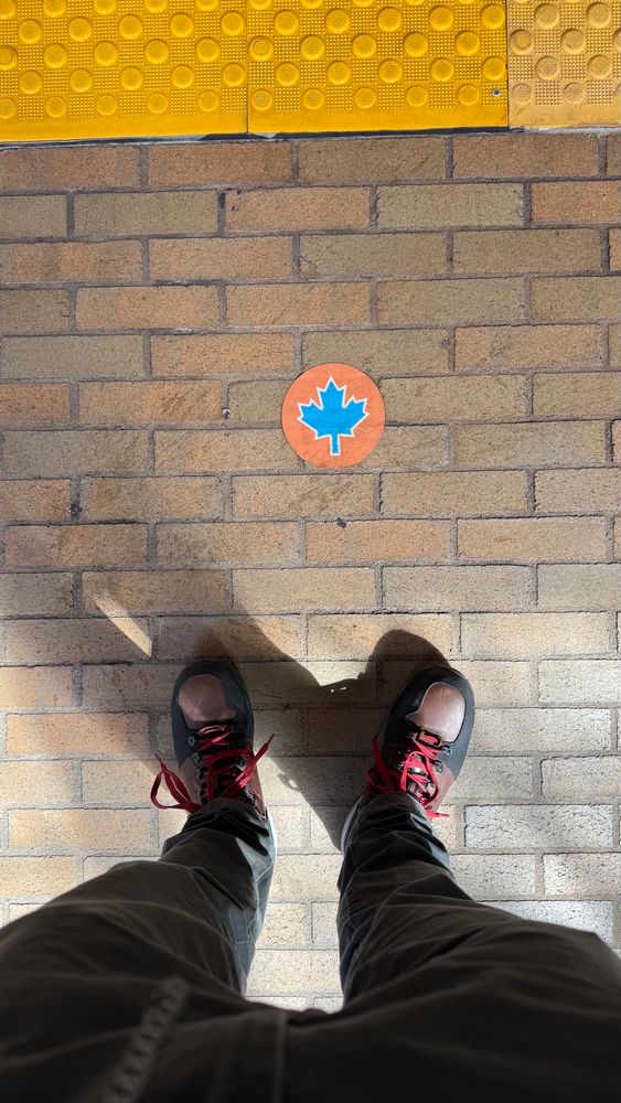 Sticker with a maple leaf on a subway platform
