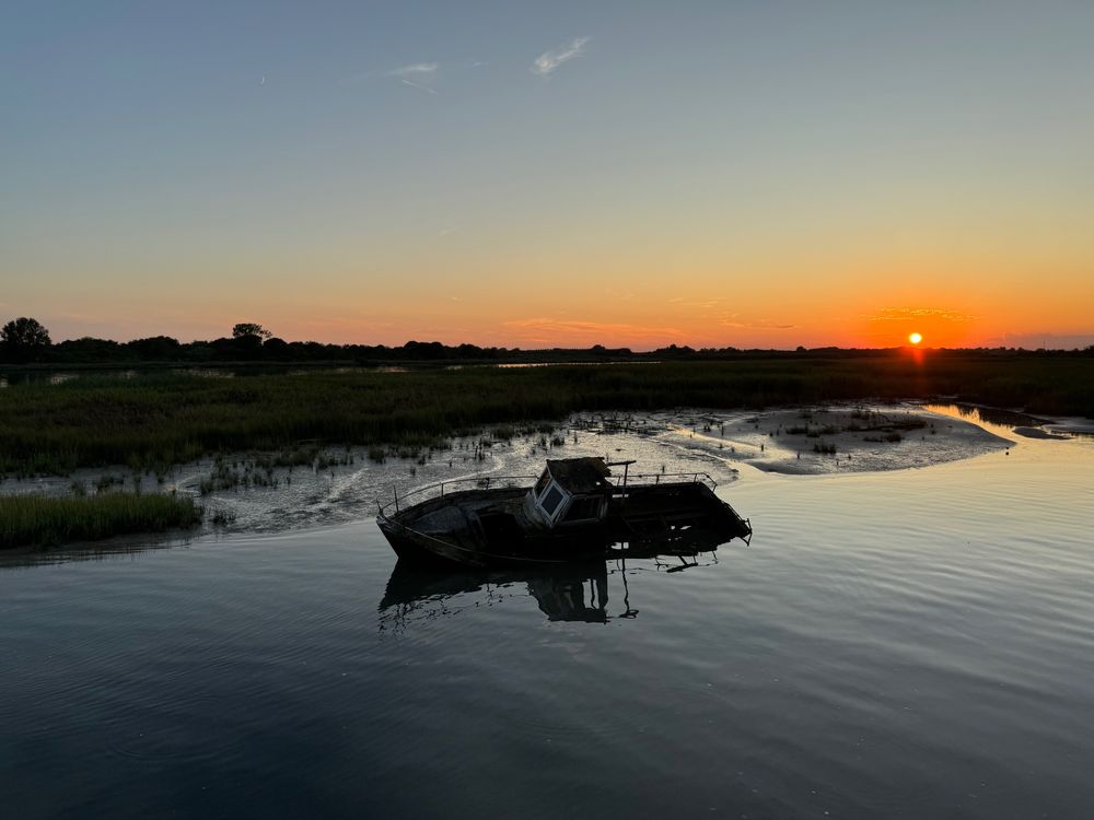 Photo of a boat wreck in Lignano Sabbiadoro, Italy.
Photo taken in the evening at sundown.