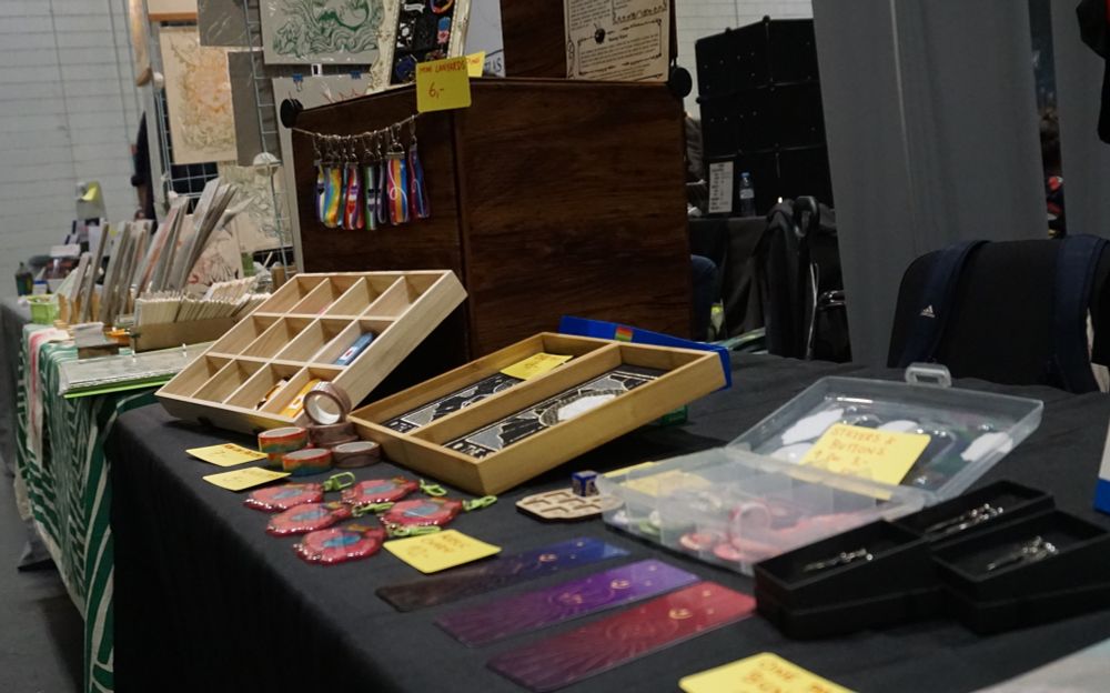 A closeup of some of Toto's wares, bookmarks, pins, washitape, and keychains.