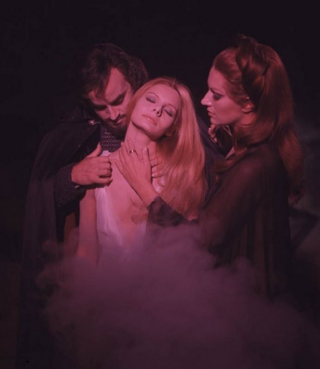 Evil Paul Naschy vampire fondling a hot lady with another hote lady.