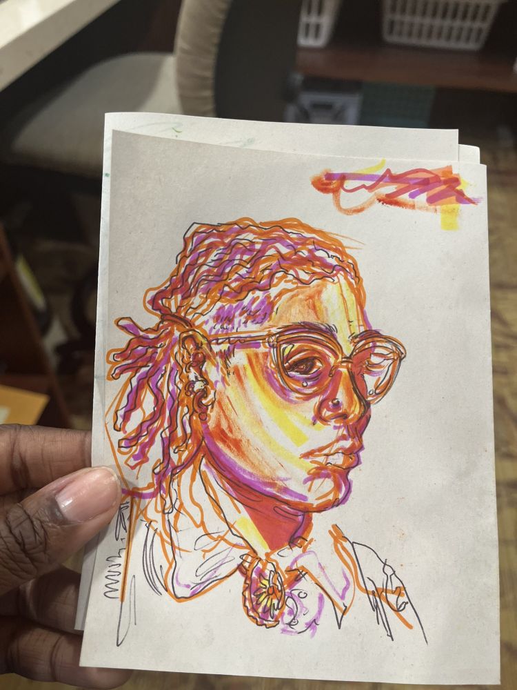 Self portrait of my profile with my locs in pigtails made with fuchsia, yellow, orange and red markers on a tiny page of white construction paper