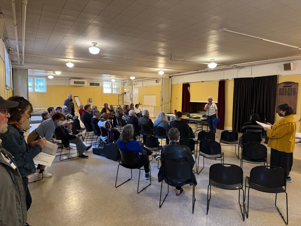 A main group of neighbors discussing how best to support their community. 