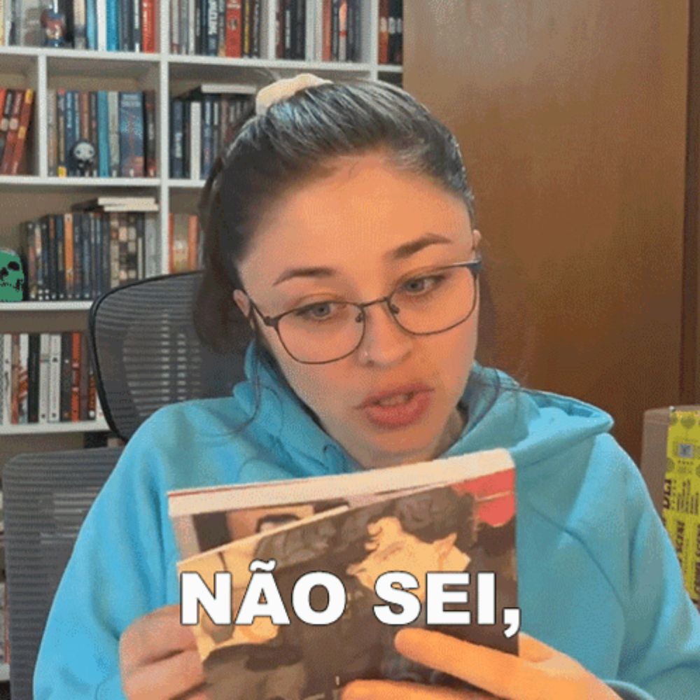 a woman wearing glasses is holding a book that says " não sei "