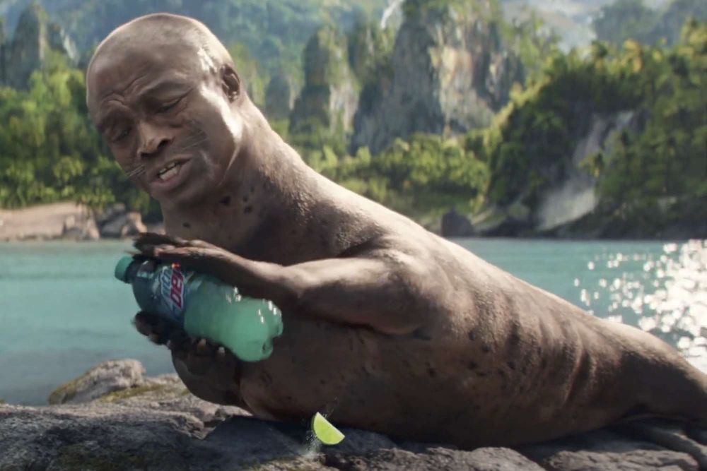 The head of singer Seal on the body of a seal, holding a Mountain Dew 