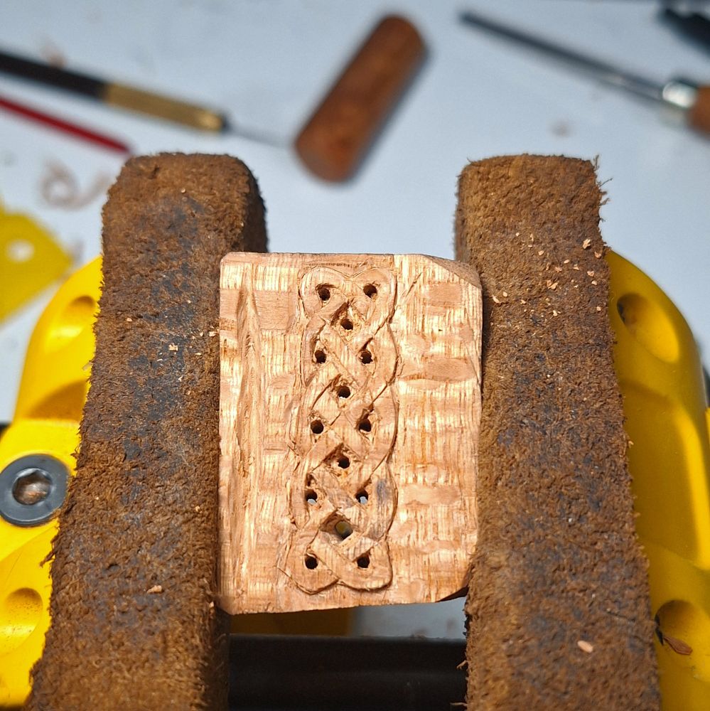 A Celtic knot in a piece of wood.