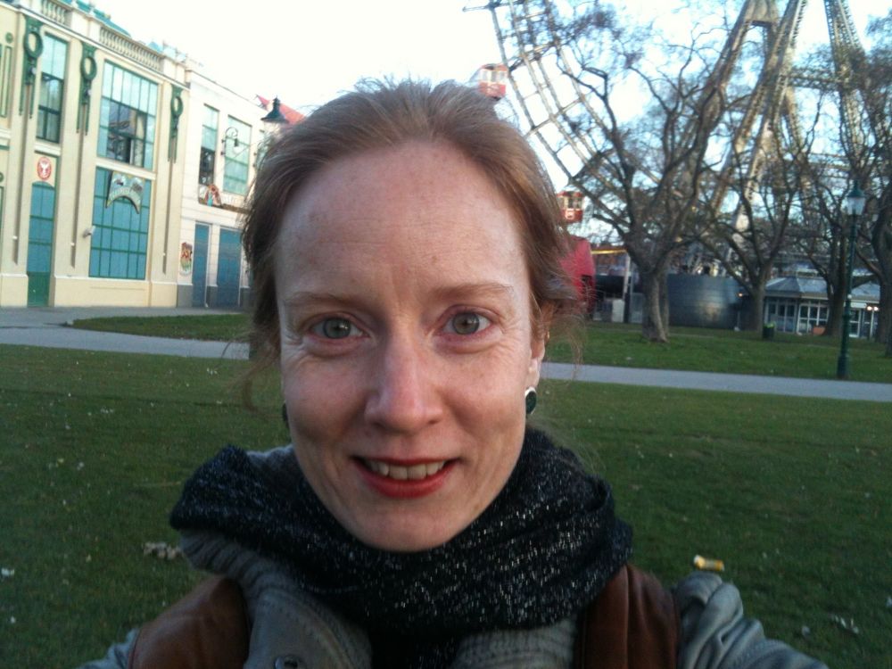 Benita in front of the Prater Ferris wheel in daytime