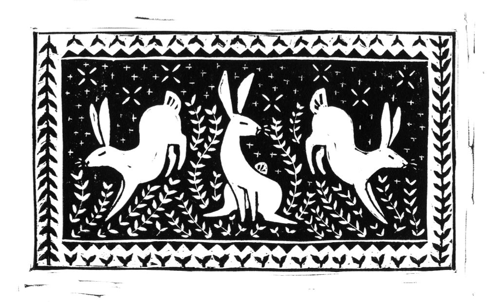 linoprint of three rabbits.  The middle rabbit sits at attention while the two rabbits on either side of him leap away. a border of plants surrounds them. 