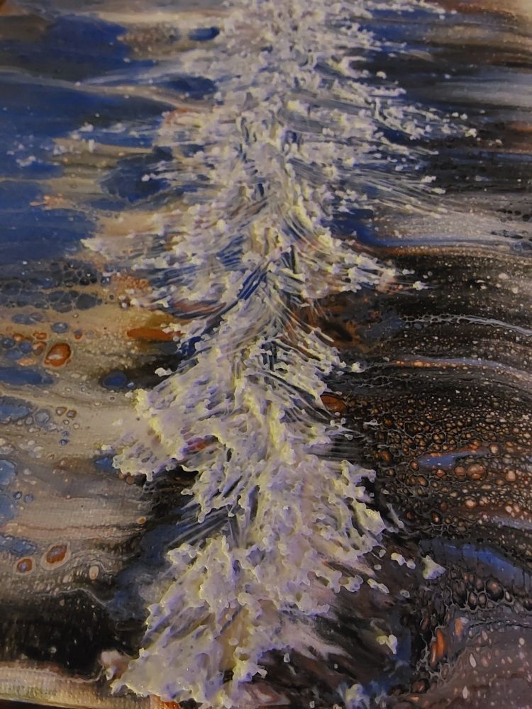 Acrylic medium still wet and white, slathered down the centre,vertically,  of an abstract painting composed of cloth swipes and bubbles radiating from the centre line, outward.