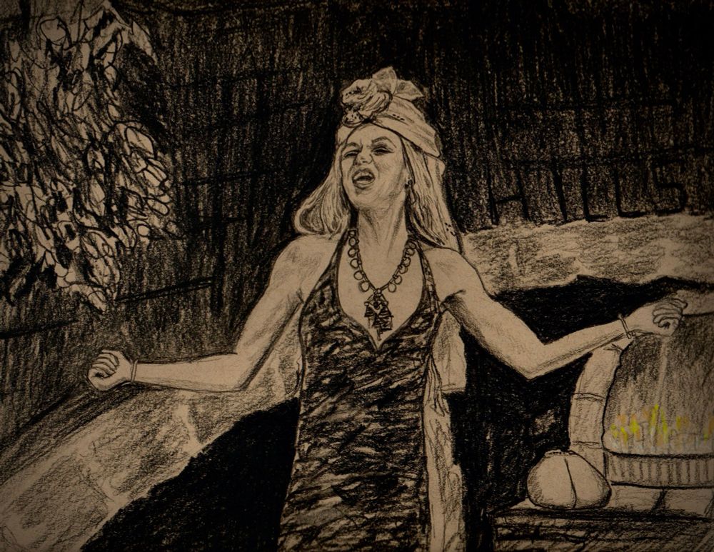A pencil sketch on brown toned paper of Elayne belting out the song ‘Hills of Tanchico’ with arms out to either side and fists clenched. She is wearing local garb. A slim black and color streaked dress with a head wrap above retaining her veil.