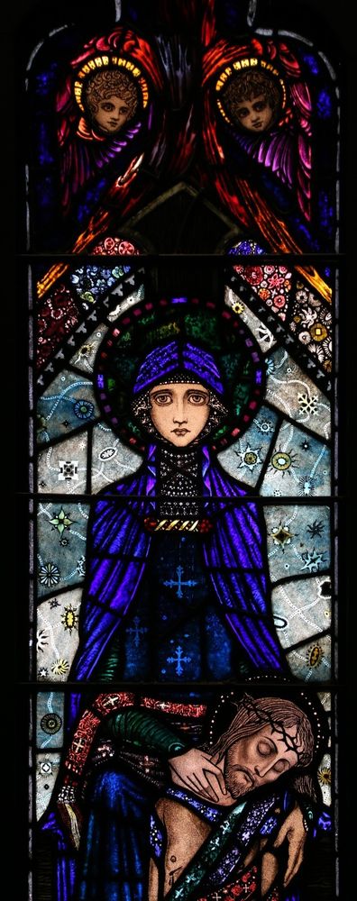 A Harry Clarke stained glass window of Mary holding the body of Jesus