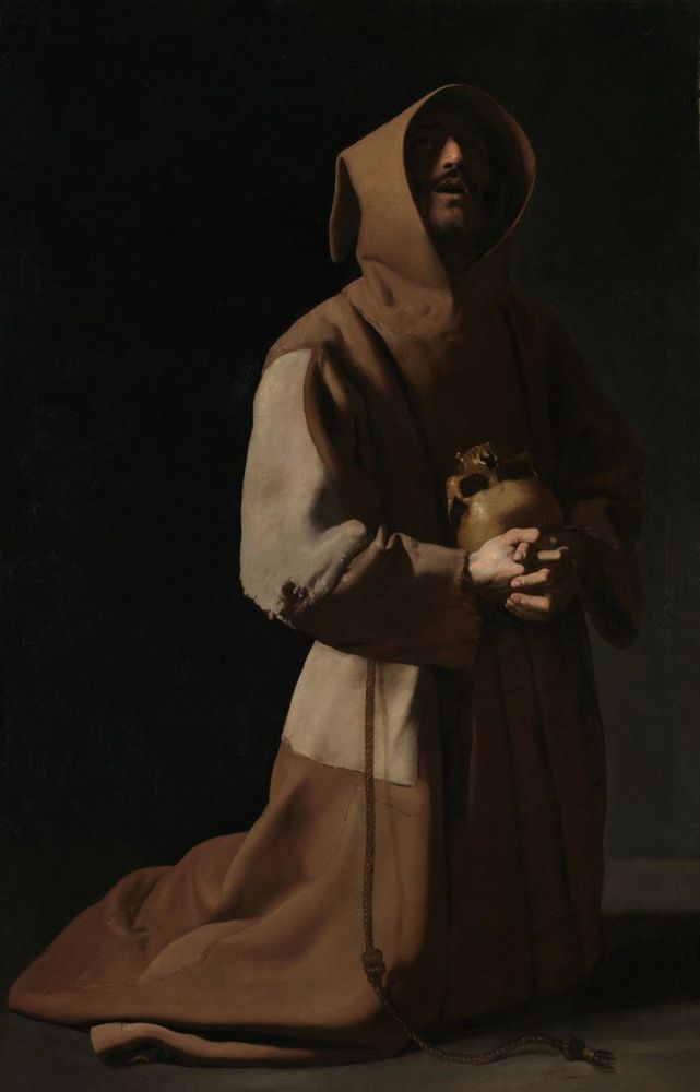 A Francisco de Zubarán painting of Saint Francis in prayer, holding a skull