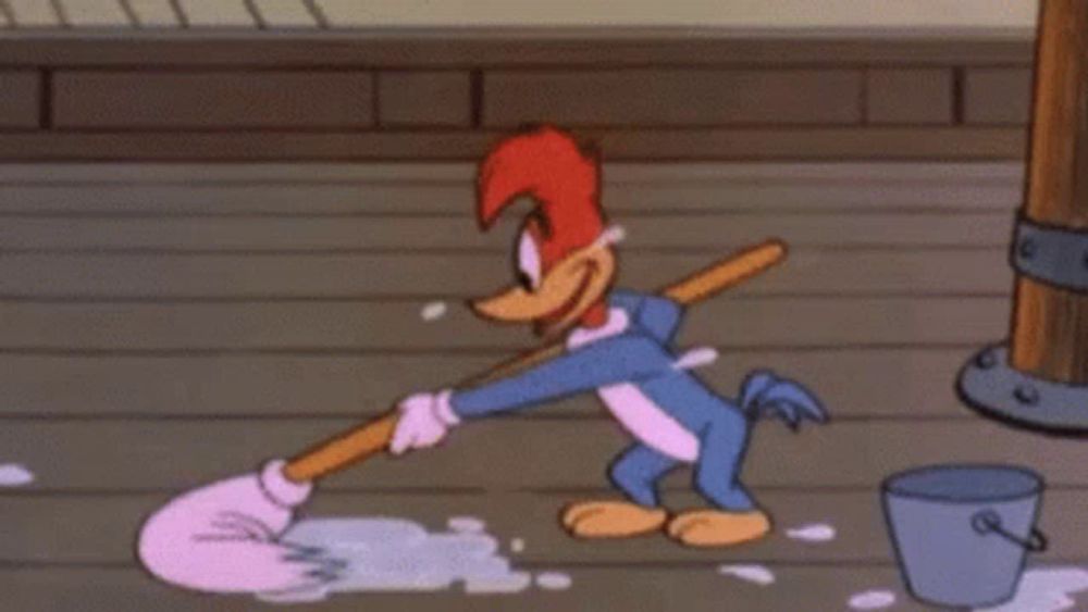 woody woodpecker is mopping the floor in a cartoon