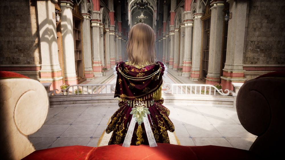 A shot from behind Nikki. Ahead is a palace corridor with columns on either side, european style brick walls and tile floor. She is sat on a red plush throne and has shoulder length brown hair, golden eyes, a tiara and a red and gold prince outfit with lacy white ribbon coming from a brooch at her back and a shoulder cape. 
