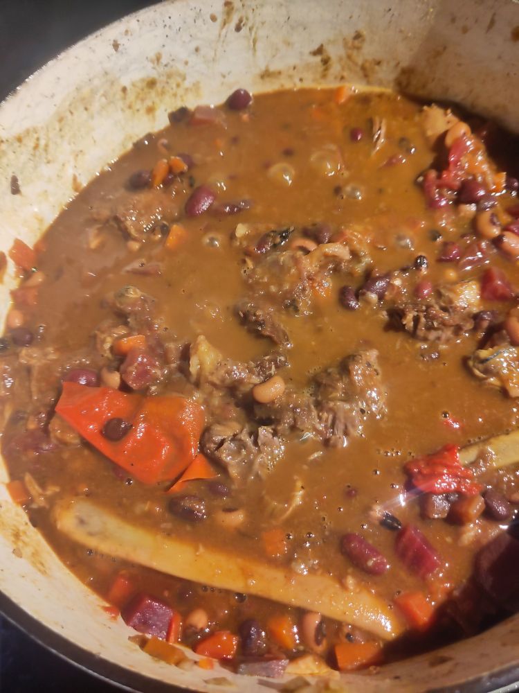 A delicious sludge with a glistening pork rib sticking out next to a chill and some hints of meat, beans 