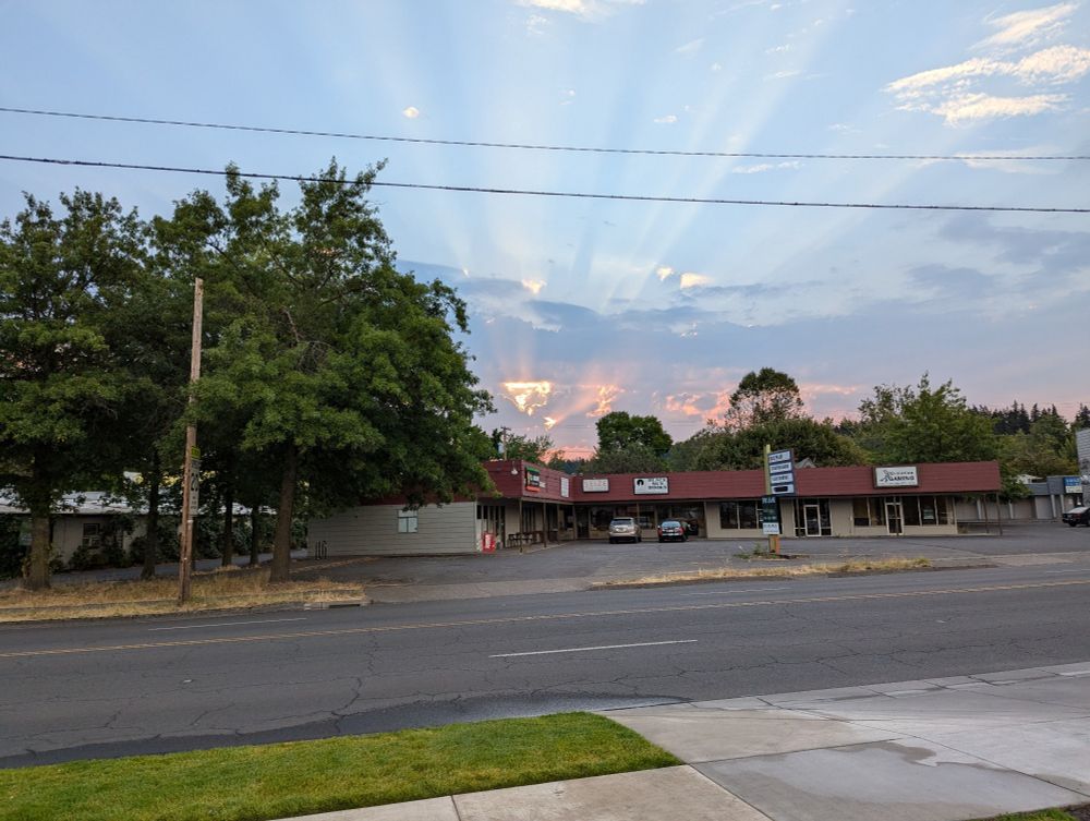Sunbeams from a lovely sunrise shining dramatically through clouds.