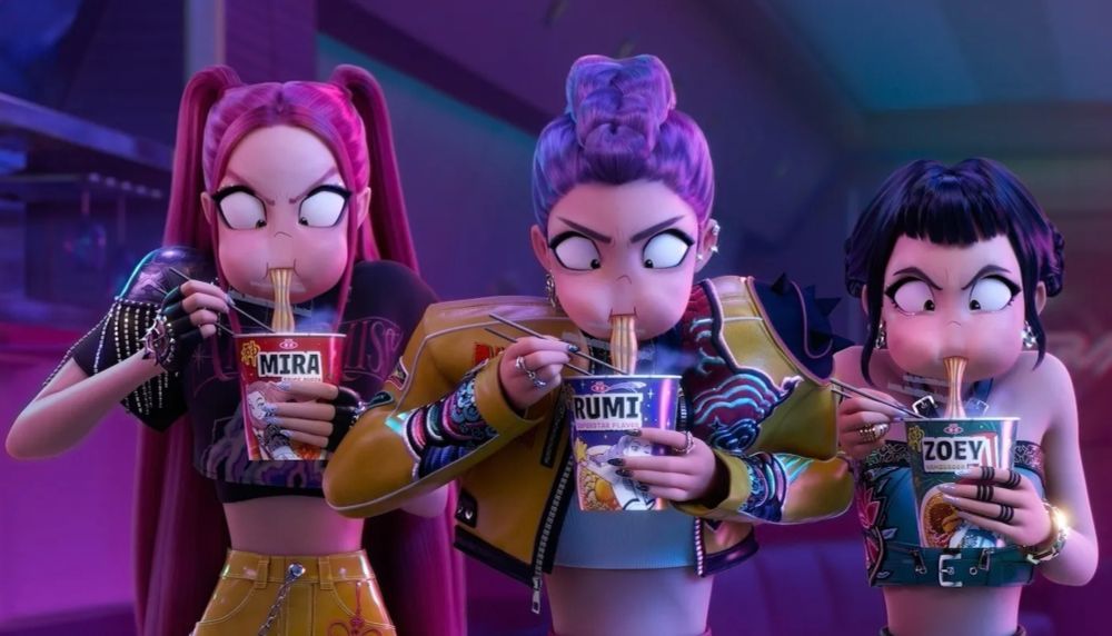 Mira, Rumi and Zoey from the film KPOP Demon Hunters eating noodles from pots with their names on.