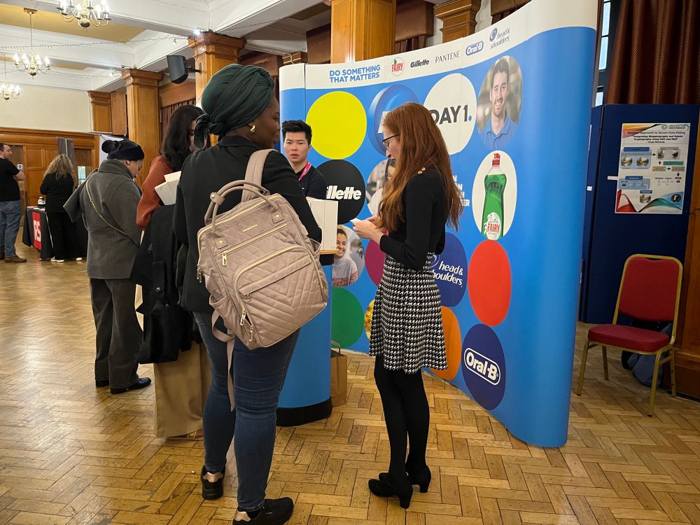 The P&G stall at the Lovelace Colloquium. Hannah Grimes came to Lovelace as a student, and now runs their stall and was a judge for one of the poster prize contests. 