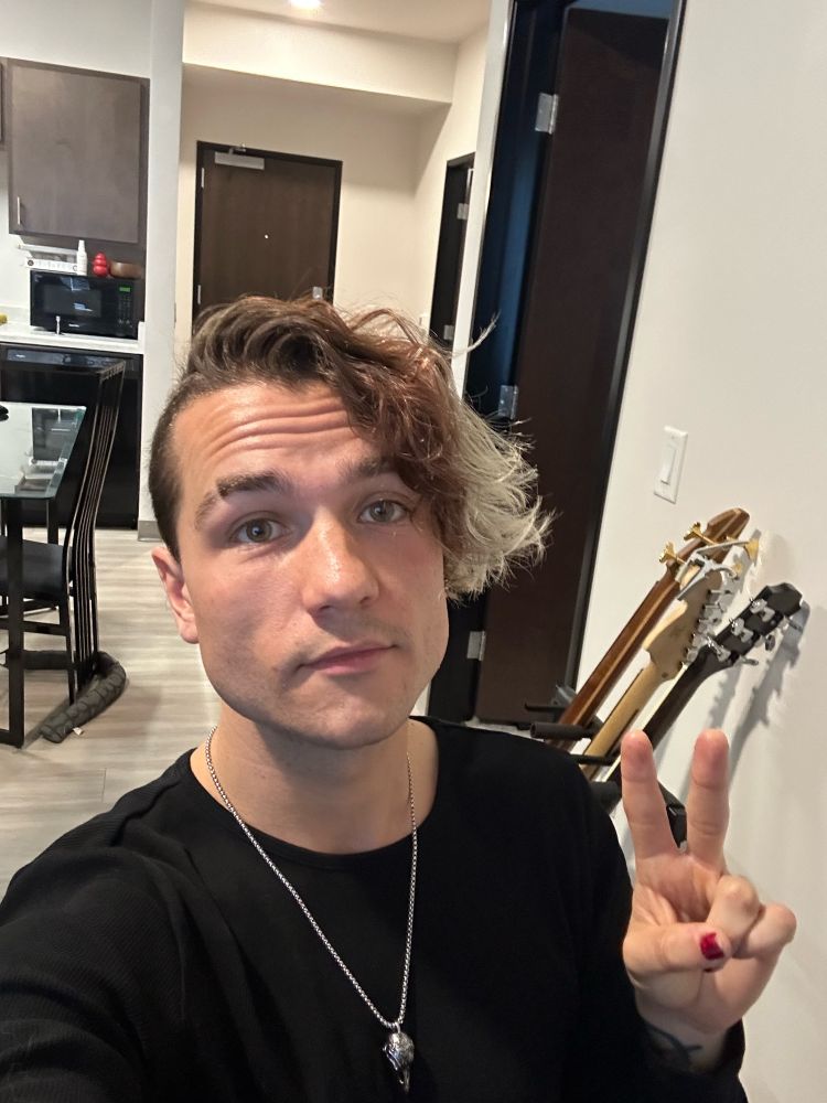 miles holding up a peace sign