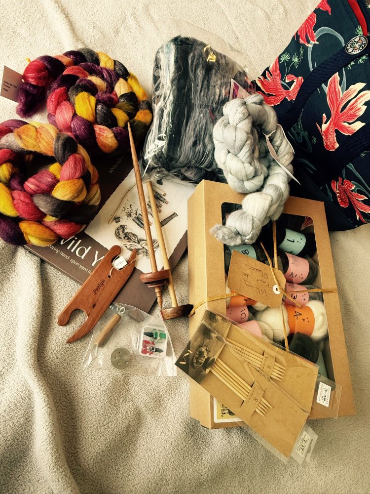 A pile of fibre and weaving and knitting tools on my bed. It’s a cluttered mess, better photos with better descriptions when I do the blog post - sorry. 