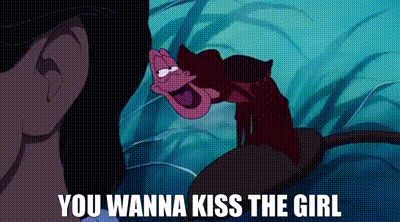 Sebastian from The Little Mermaid whispering/singing “You wanna kiss the girl” in Eric’s ear