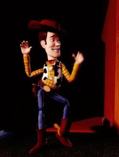 a toy story character named woody is dancing in a dark room