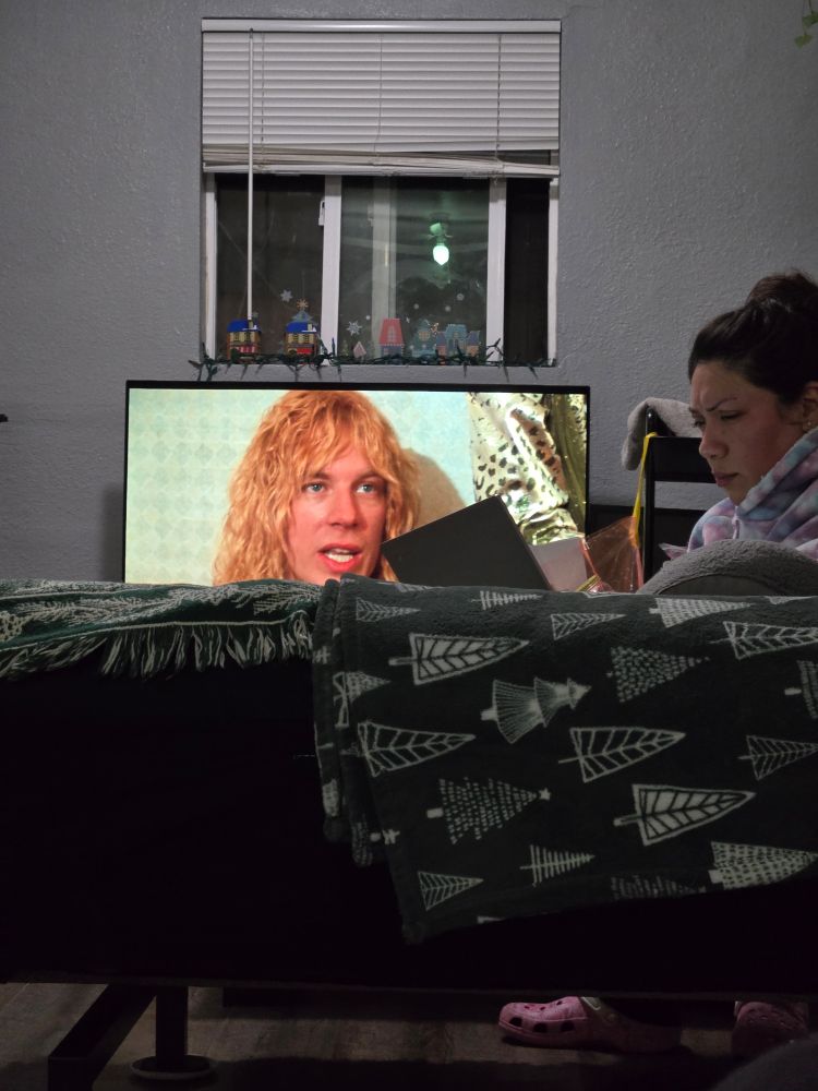 It's my wife on a laptop while Spinal Tap is playing in the background. 