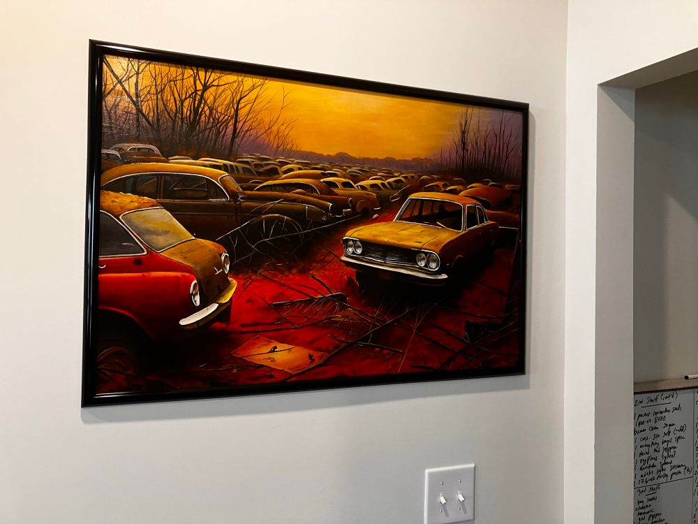 Painting by Ericksen Linn, #clumsysurgeon, of rusting cars in a car graveyard with an apocalyptic background.