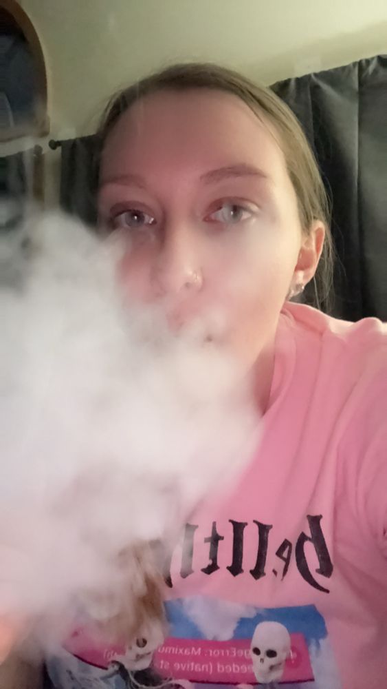 hailien with a sizable cloud of smoke concealing some of her face