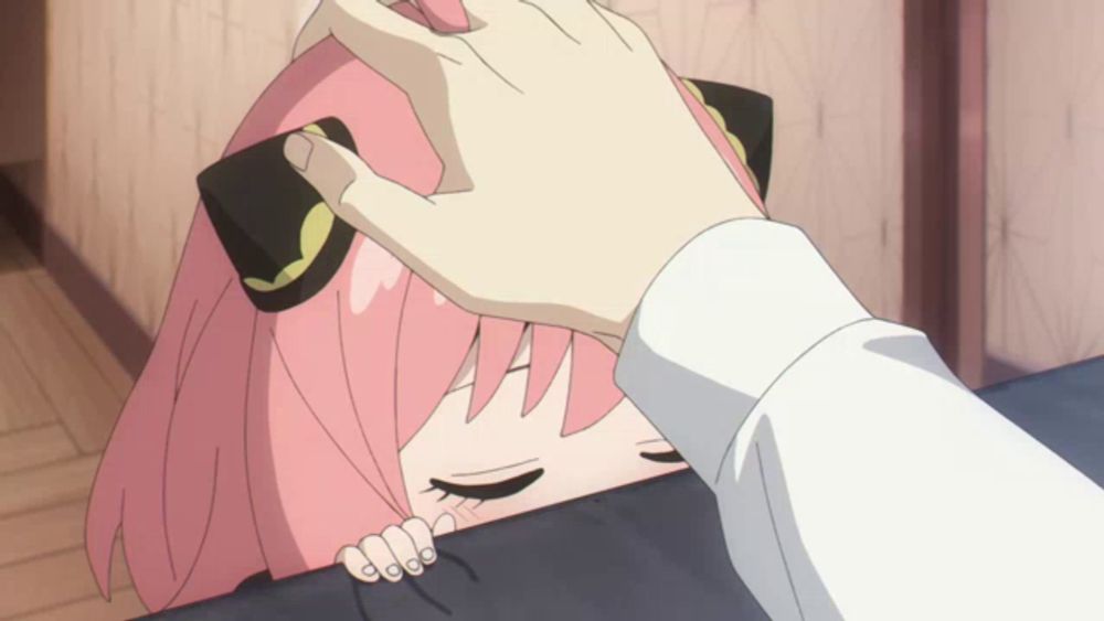 a girl with pink hair is being touched by a person