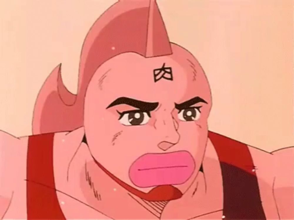 a close up of a cartoon character with chinese writing on his forehead