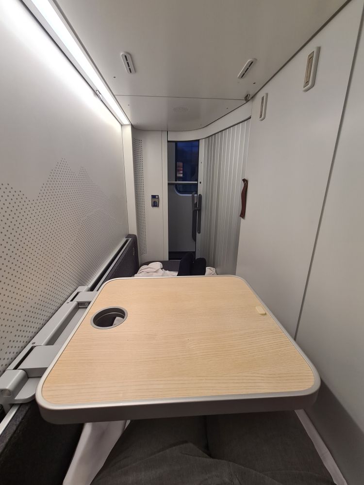 Inside room looking back towards the slide door. The drop down table is down