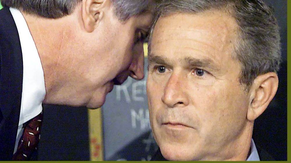 Andrew card telling dumb fucknut genocidaire Large Adult Failson Bush Jr that a 2nd plane has his the World trade center 