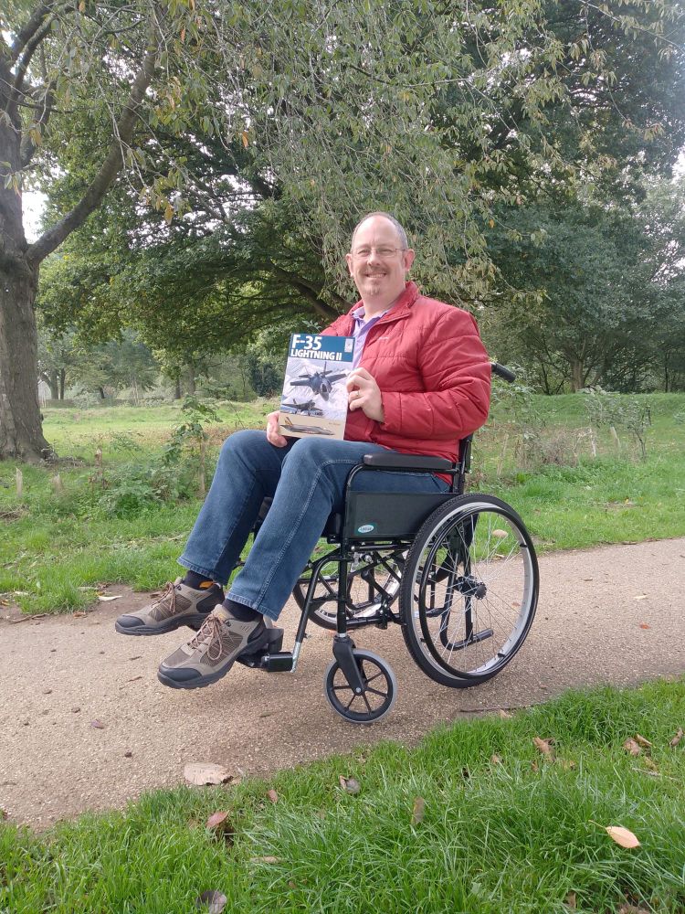 As the sharp eyed among you all may have noticed I have a new addition in my life; a chair with wheels (foot plates are now adjusted). So what happened? 
On the evening of 14 September I was taken into hospital with a suspected stroke. Thankfully a CT scan showed I had not suffered a stroke, but I have been diagnosed with Functional (dissociative) seizures (FDS) a clinical feature of Functional neurological disorder (FND) (I think the hospital were doing a two-for-one offer). While FDS and FND, a physical manifestation of trauma is one way to put it, are not life threatening they are life changing and annoyingly there is no direct treatment or pharmacological intervention for either of these disorders. 
As a neurological condition FNDs are considered as debilitating as Multiple Sclerosis,  Parkinson's Disease and Epilepsy, so the recovery phase means I'm currently adapting to a new lifestyle practically, emotionally and socially over the coming months. Occupational Therapy have begun the living and home adaptions, Neurology will get their grubby mitts on me in due course, Physiotherapy will help strengthen my limbs (images of preening PTIs are charging through my mind for some reason) and Speech and Language Therapy are stepping up as my swallow reflex is lagging and will they will hopefully help me manage the slurred speech I experience from time to time.
I'm still learning and the past few weeks have been a sharper learning and acceptance curve than I had anticipated. My wife Anne and our daughter Fizz, the Skipper family, all of our close friends and the NHS and Veterans Agency staff have all been phenomenally supportive, and without them I seriously dread to think what if be doing right now.
It’s not all bad though. I’ll always have a chair, I’ll never have to worry about an MoT again, and I’ll save a fortune in footwear.
Per Ardua Ad Astra!
Ben