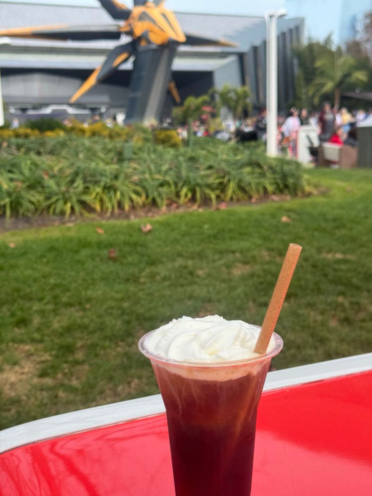 Espresso martini in front of Guardians of the Galaxy ride at Epcot. 