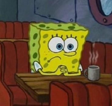 A pensive SpongeBob sitting next to a hot mug of coffee 