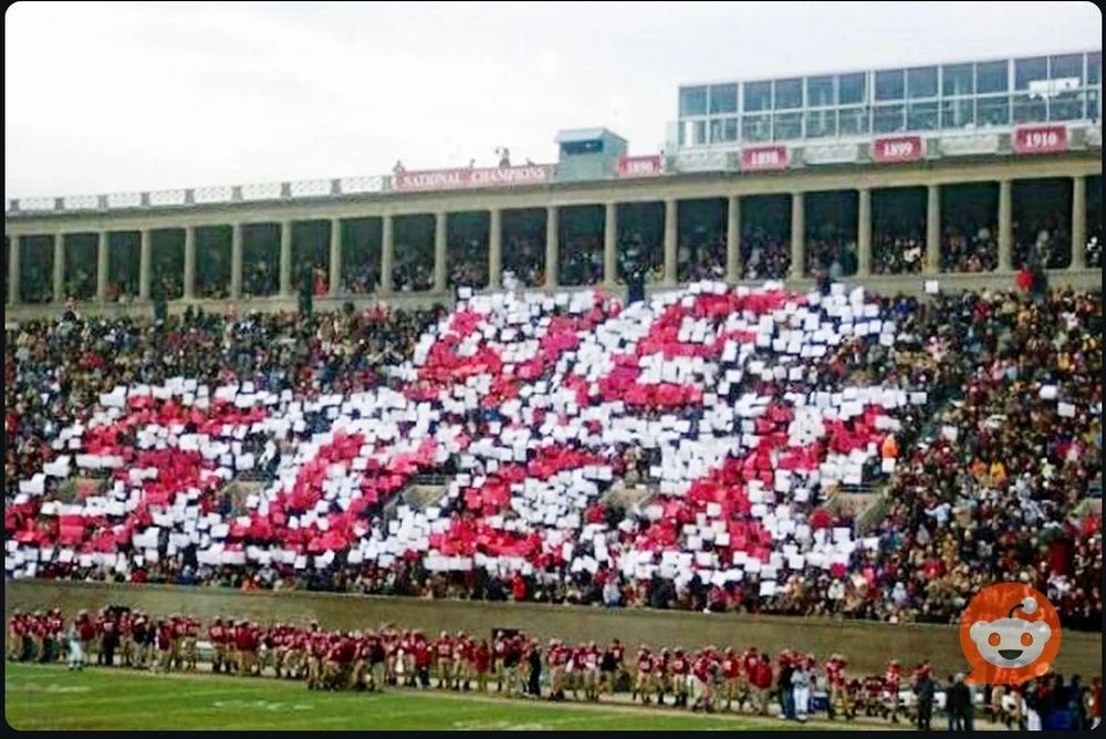 Harvard fans are tricked into holding up signs spelling out “We Suck,” which is extremely applicable to their boot-licking. 
