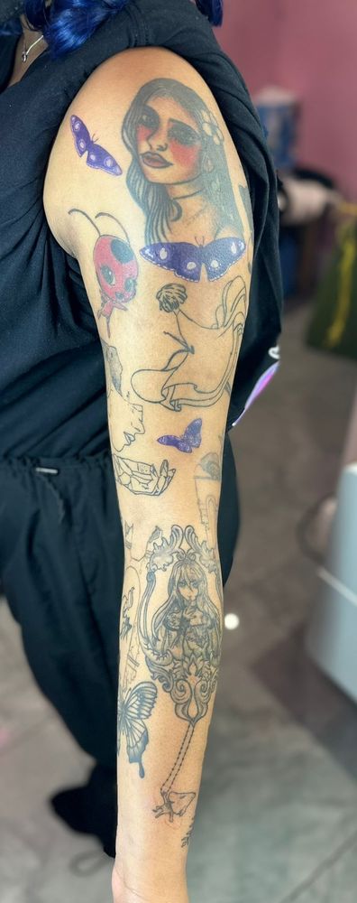 Picture of a tattoo sleeve. New additions are purple akumas flying between other features. 