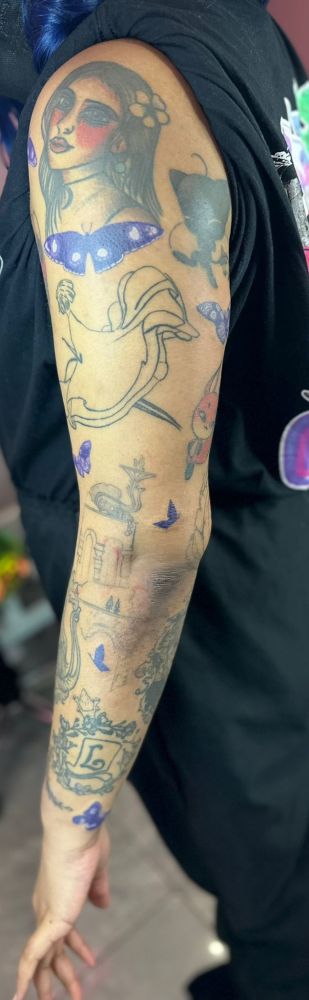 Picture of a tattoo sleeve. New additions are purple akumas flying between other features. 